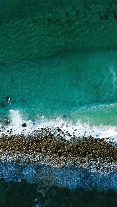 Framed Print : Image captured by a drone that shows the surprising contrast between the turquoise waters of the ocean Framed Print : Image captured by a drone that shows the surprising contrast between the turquoise waters of the ocean