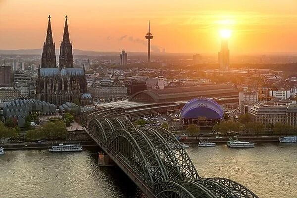 Image of Cologne with Cologne Cathedral and Rhine river during sunset in Cologne, Germany