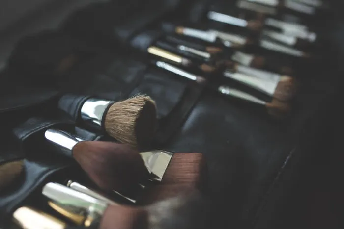 Framed Print : This image features a collection of makeup brushes