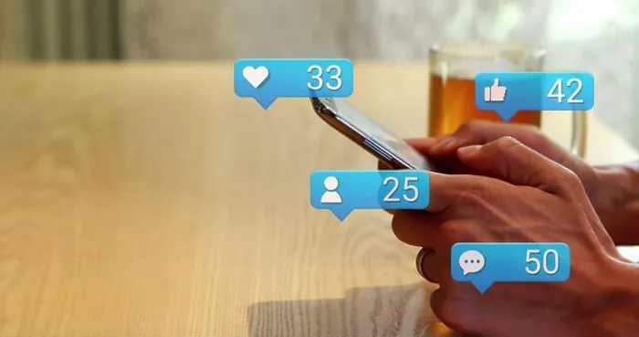 Framed Print : Image of social media icons falling over person using smartphone