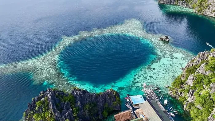 Framed Print : An incredible aerial view of a pristine coral lagoon with vibrant turquoise and deep blue waters Framed Print : An incredible aerial view of a pristine coral lagoon with vibrant turquoise and deep blue waters