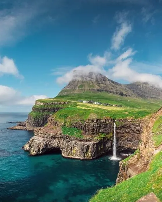 Framed Print : Incredible day view of Mulafossur waterfall in Gasadalur village, Vagar Island of the Faroe Islands, Denmark. Landscape photography Framed Print : Incredible day view of Mulafossur waterfall in Gasadalur village, Vagar Island of the Faroe Islands, Denmark. Landscape photography