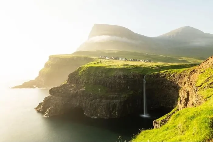 Framed Print : Incredible day view of Mulafossur waterfall in Gasadalur village, Vagar Island of the Faroe Islands, Denmark. Landscape photography Framed Print : Incredible day view of Mulafossur waterfall in Gasadalur village, Vagar Island of the Faroe Islands, Denmark. Landscape photography