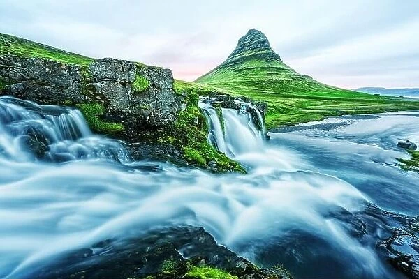 Incredible landscape with Kirkjufellsfoss waterfall and Kirkjufell mountain, Iceland, Europe