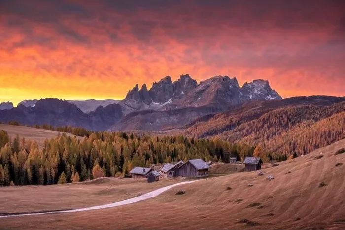 Framed Print : Incredible red sunset at Fuchiade valley in Italian Dolomites countryside. Wooden huts, orange larches forest Framed Print : Incredible red sunset at Fuchiade valley in Italian Dolomites countryside. Wooden huts, orange larches forest