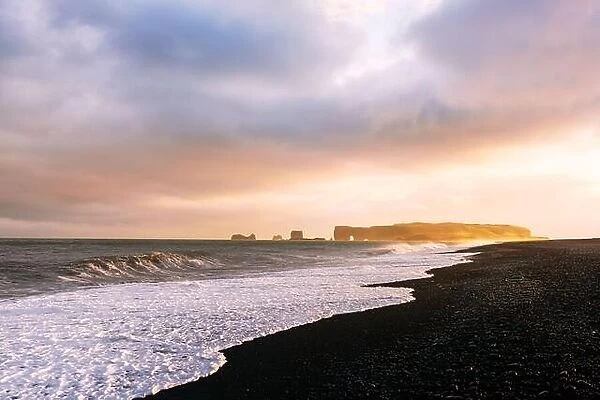Incredible sunset light and large waves on Black beach, Vik, Iceland. Landscape photography