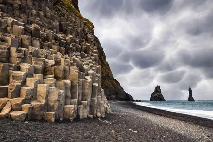 Framed Print : Incredible view on Black beach and Troll toes cliffs in cloudy weather. Stormy sky with menacing mammatus clouds on background Framed Print : Incredible view on Black beach and Troll toes cliffs in cloudy weather. Stormy sky with menacing mammatus clouds on background