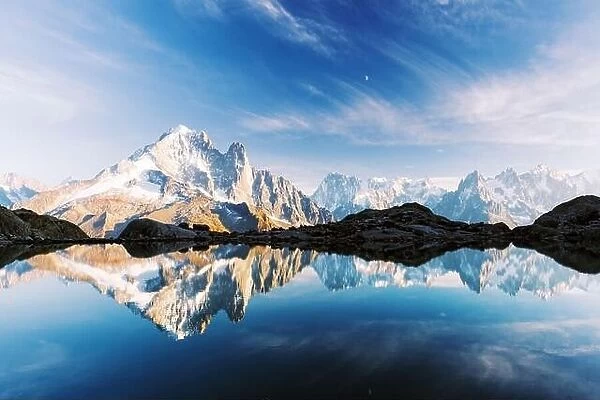 Incredible view of clear water and sky reflection on Lac Blanc lake in France Alps. Monte Bianco mountains range on background