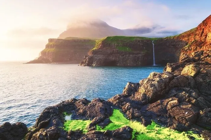 Framed Print : Incredible view of Mulafossur waterfall in Gasadalur village, Vagar Island of the Faroe Islands, Denmark. Landscape photography Framed Print : Incredible view of Mulafossur waterfall in Gasadalur village, Vagar Island of the Faroe Islands, Denmark. Landscape photography