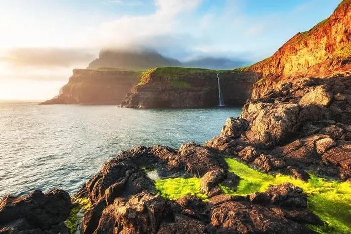 Framed Print : Incredible view of Mulafossur waterfall in Gasadalur village, Vagar Island of the Faroe Islands, Denmark. Landscape photography Framed Print : Incredible view of Mulafossur waterfall in Gasadalur village, Vagar Island of the Faroe Islands, Denmark. Landscape photography