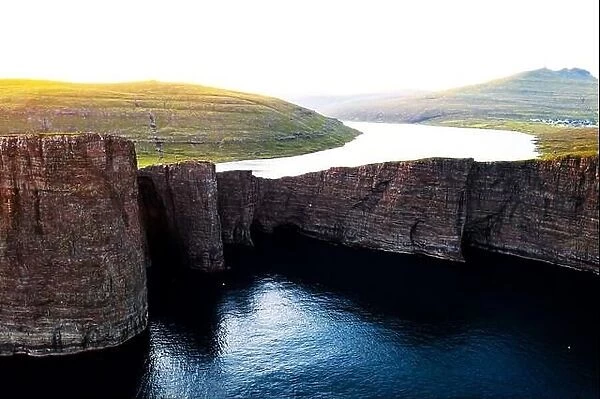 Incredible view of Sorvagsvatn lake on cliffs of Vagar island in sunset time, Faroe Islands, Denmark. Landscape photography