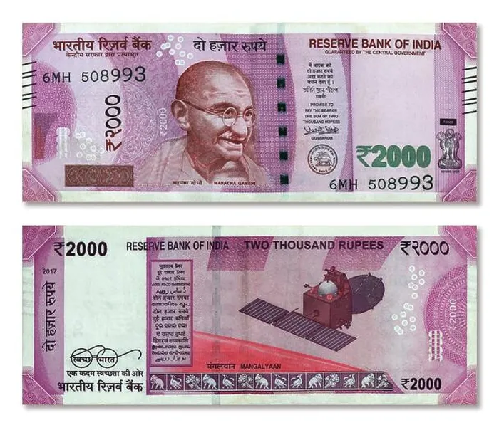 Framed Print : Indian 2000 rupee paper currency note front and back side isolated on white background Framed Print : Indian 2000 rupee paper currency note front and back side isolated on white background