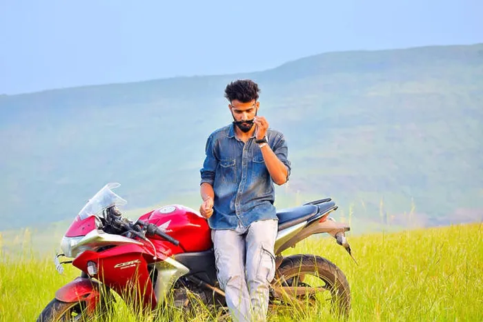 Framed Print : Indian Boy with Motor Bike and mountain background. Pune, Maharashtra Framed Print : Indian Boy with Motor Bike and mountain background. Pune, Maharashtra