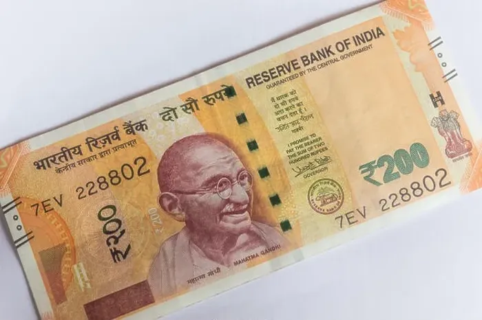 Framed Print : Indian currency 200 Rs note placed diagonally on a white background Framed Print : Indian currency 200 Rs note placed diagonally on a white background