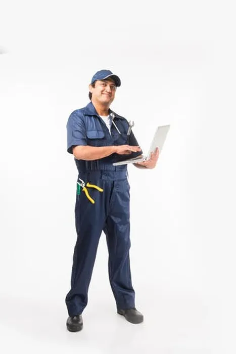 Framed Print : Indian happy auto mechanic in blue suit and cap holding spanner tool in action, isolated over white background Framed Print : Indian happy auto mechanic in blue suit and cap holding spanner tool in action, isolated over white background