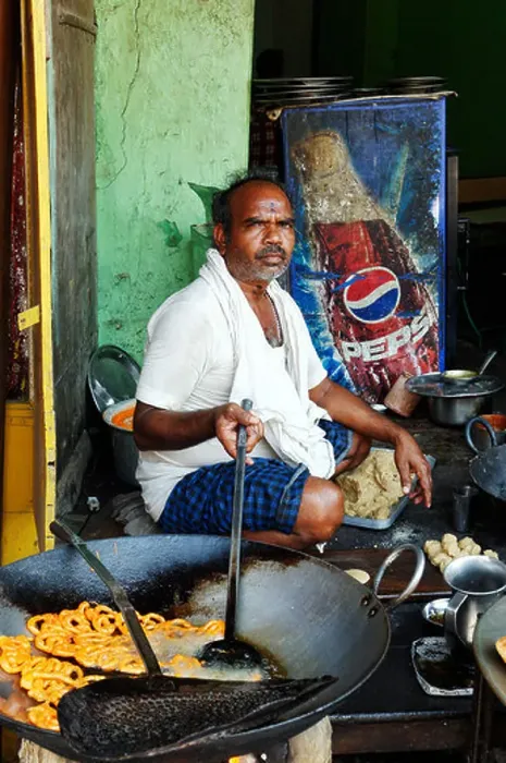 Framed Print : An Indian man cooking street food Framed Print : An Indian man cooking street food