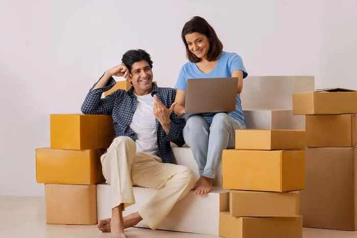 Framed Print : Indian middle age couple using laptop and planning for new ideas on the decoration of new room