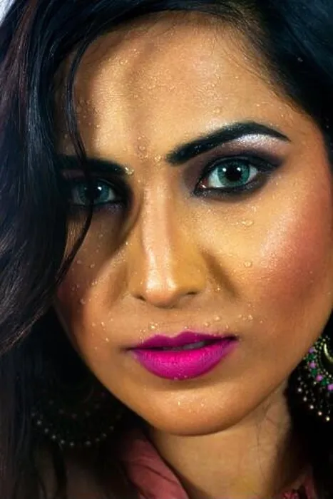 Framed Print : Indian Model face closeup looking at camera and water on face Framed Print : Indian Model face closeup looking at camera and water on face