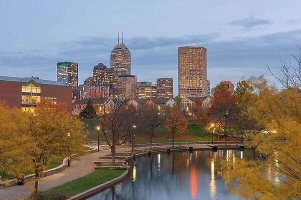 Indianapolis, Indiana, USA river walk and skyline at dusk in the evening