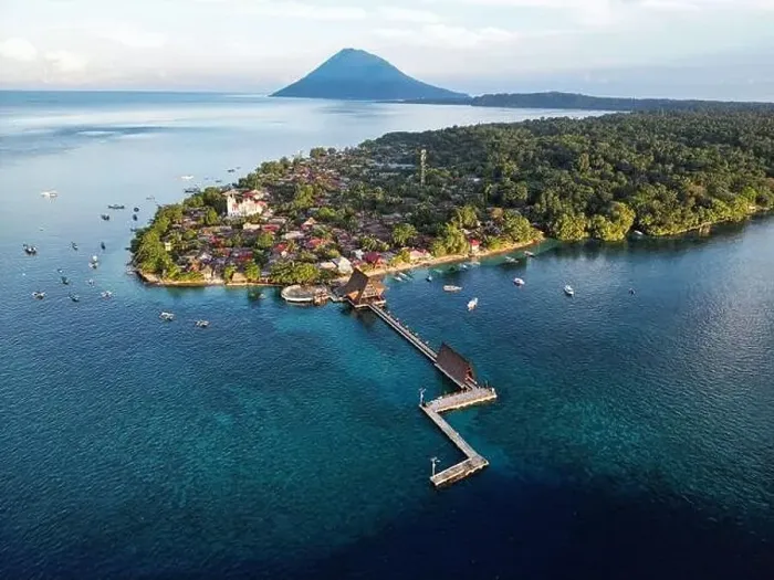 Framed Print : Indonesia Bunaken - Drone view Bunaken Island with coral reef and jetty and Manadotua Island