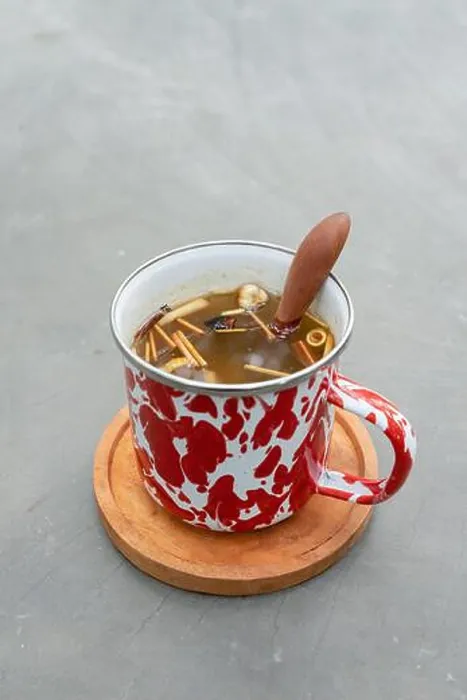 Framed Print : Indonesian herbal drink wedang uwuh served in a stainless cup with forest background Framed Print : Indonesian herbal drink wedang uwuh served in a stainless cup with forest background