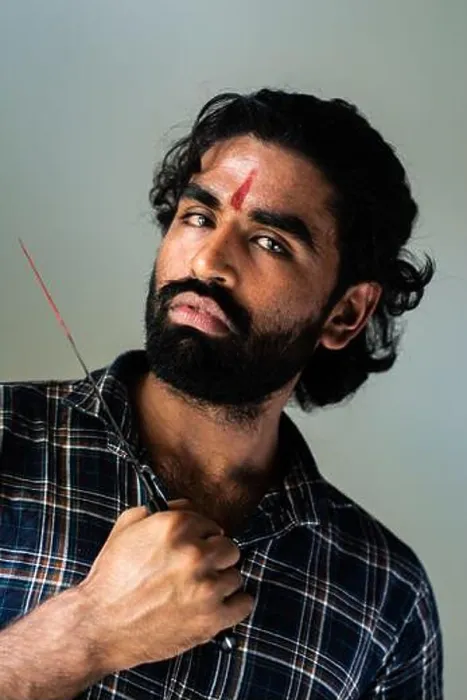 Framed Print : indoor portrait of a bearded Indian male wearing a man bun Framed Print : indoor portrait of a bearded Indian male wearing a man bun