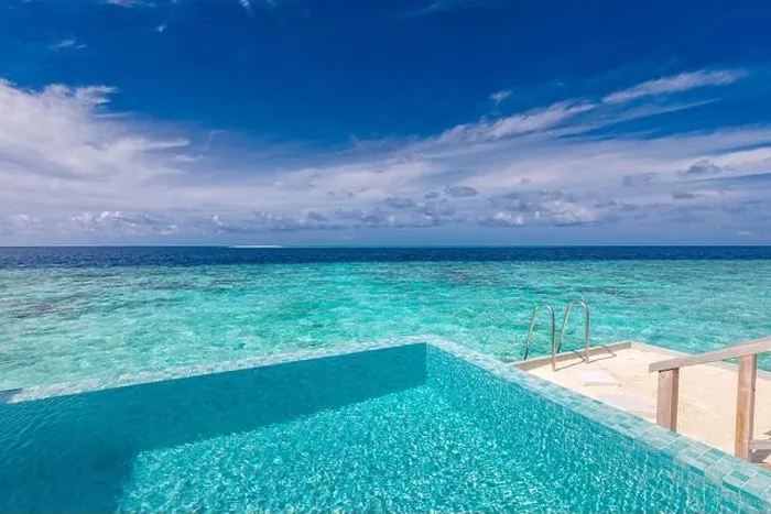 Framed Print : Infinity pool on the bright summer day. Infinity swimming pool in luxury hotel resort, tropical seascape, lagoon. Amazing summer vacation leisure view Framed Print : Infinity pool on the bright summer day. Infinity swimming pool in luxury hotel resort, tropical seascape, lagoon. Amazing summer vacation leisure view