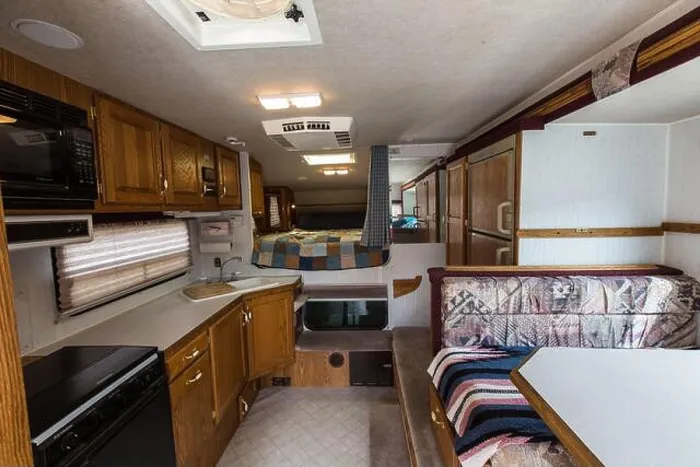 Framed Print : Interior of an Artic Fox truck camper showing the kitchen, dinette and bed Framed Print : Interior of an Artic Fox truck camper showing the kitchen, dinette and bed