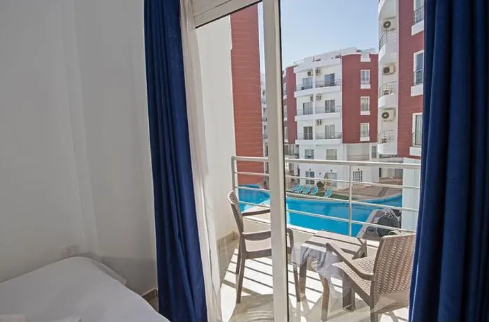 Framed Print : Interior design decor furnishing of luxury show home bedroom showing furniture and double bed with balcony