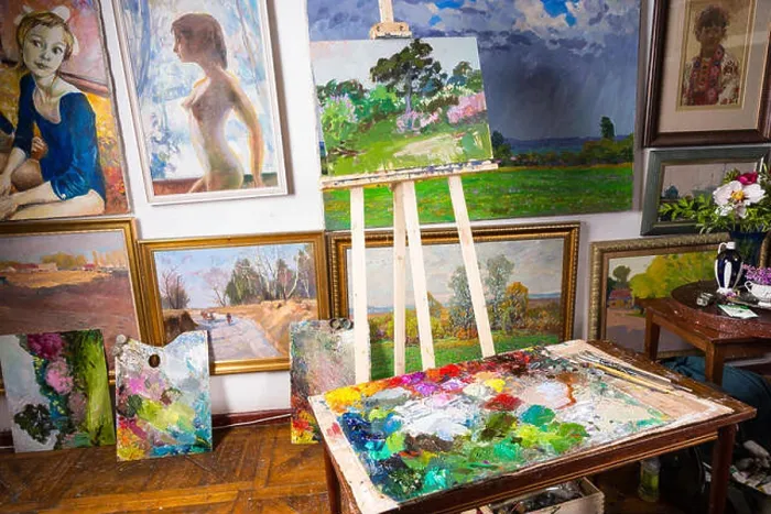 Framed Print : Interior of a professional artists studio or gallery with colorful canvases covering a variety of subjects hanging Framed Print : Interior of a professional artists studio or gallery with colorful canvases covering a variety of subjects hanging