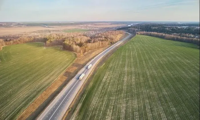 Framed Print : International cargo logistics theme. Truck carry load aerial drone view Framed Print : International cargo logistics theme. Truck carry load aerial drone view