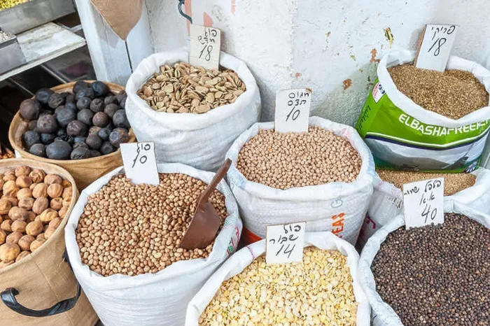 Framed Print : Israel, Tel Aviv-Yafo - 29 March 2019: Fava and other beans sold in shuk Levinsky market Framed Print : Israel, Tel Aviv-Yafo - 29 March 2019: Fava and other beans sold in shuk Levinsky market