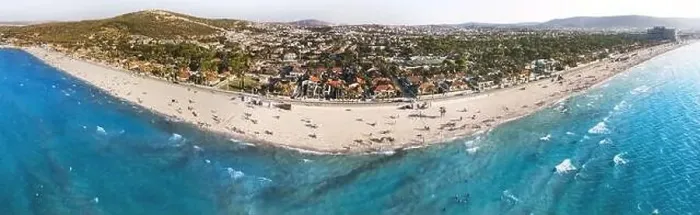 Framed Print : Izmir, Turkey - August 17, 2022: Aerial panoramic drone photo of the Ilica beach in summer Cesme Izmir Turkey Framed Print : Izmir, Turkey - August 17, 2022: Aerial panoramic drone photo of the Ilica beach in summer Cesme Izmir Turkey