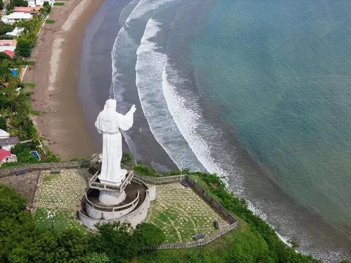 Framed Print : Jesus christ statue monument on green sea background aerial drone view Framed Print : Jesus christ statue monument on green sea background aerial drone view