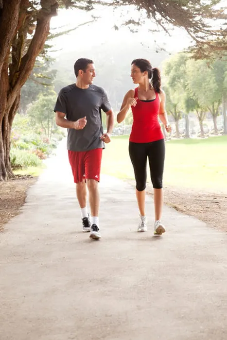 Framed Print : Two joggers are running along a path Framed Print : Two joggers are running along a path
