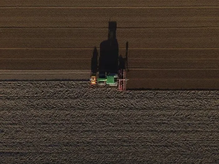 Framed Print : A John Deere Tractor seeds a previously cultivated field with sweetcorn, late in the evening Framed Print : A John Deere Tractor seeds a previously cultivated field with sweetcorn, late in the evening