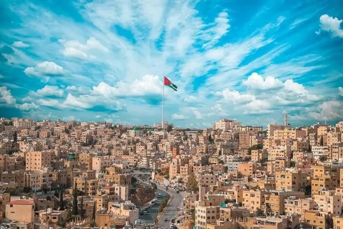Framed Print : Jordan flag in Amman, landscape view of cloudy sky background at the downtown Framed Print : Jordan flag in Amman, landscape view of cloudy sky background at the downtown