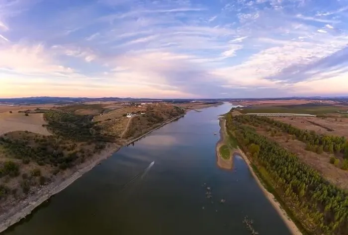 Framed Print : Juromenha castle, village and boat in Guadiana river drone aerial view at sunset in Alentejo, Portugal Framed Print : Juromenha castle, village and boat in Guadiana river drone aerial view at sunset in Alentejo, Portugal