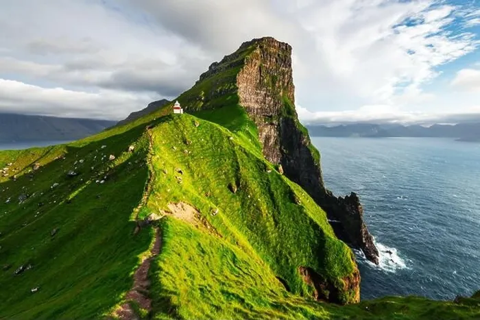 Framed Print : Kallur lighthouse on green hills of Kalsoy island, Faroe islands, Denmark. Landscape photography Framed Print : Kallur lighthouse on green hills of Kalsoy island, Faroe islands, Denmark. Landscape photography