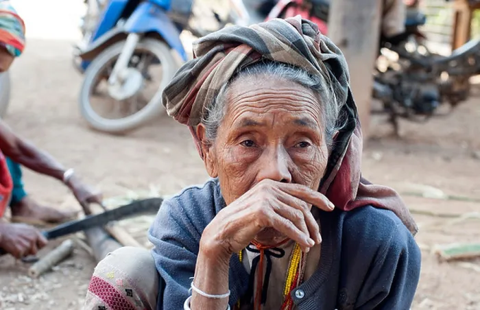Framed Print : Karen villager in contemplative mood sits outside. Huay Pakoot village, northern Thailand Framed Print : Karen villager in contemplative mood sits outside. Huay Pakoot village, northern Thailand