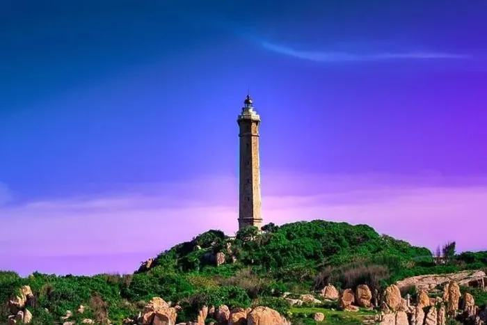 Framed Print : Ke Ga lighthouse at sunset in Vietnam. Purple blue sky background Framed Print : Ke Ga lighthouse at sunset in Vietnam. Purple blue sky background