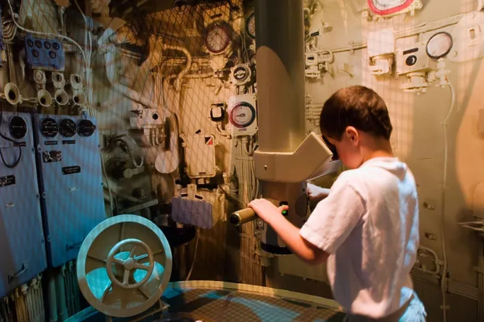 Framed Print : Kid looking through periscope at the U 505 submarine exhibit at the Museum of Science and Industry Chicago Illinois Framed Print : Kid looking through periscope at the U 505 submarine exhibit at the Museum of Science and Industry Chicago Illinois