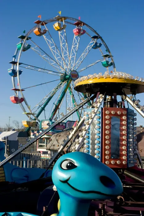 Framed Print : Kiddie ride and Ferris wheel at a carnival in the United States Framed Print : Kiddie ride and Ferris wheel at a carnival in the United States