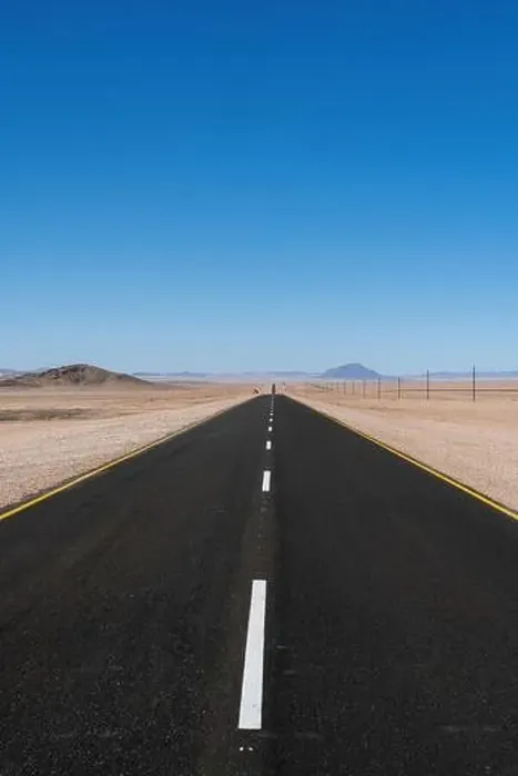 Framed Print : A kilometer long paved straight road in the desert of Namibia Framed Print : A kilometer long paved straight road in the desert of Namibia