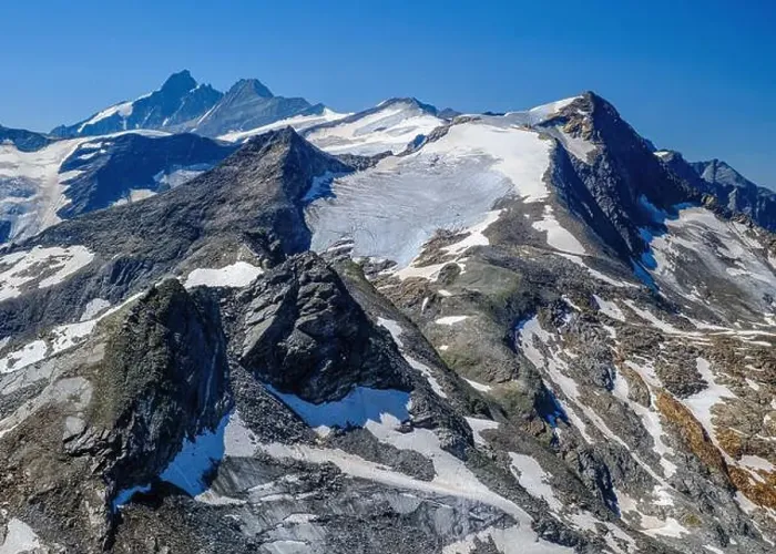 Framed Print : Kitzsteinhorn Glacier with rugged peaks under a clear blue sky. Aerial view. Kaprun, Zell Am See, Austrian Alps
