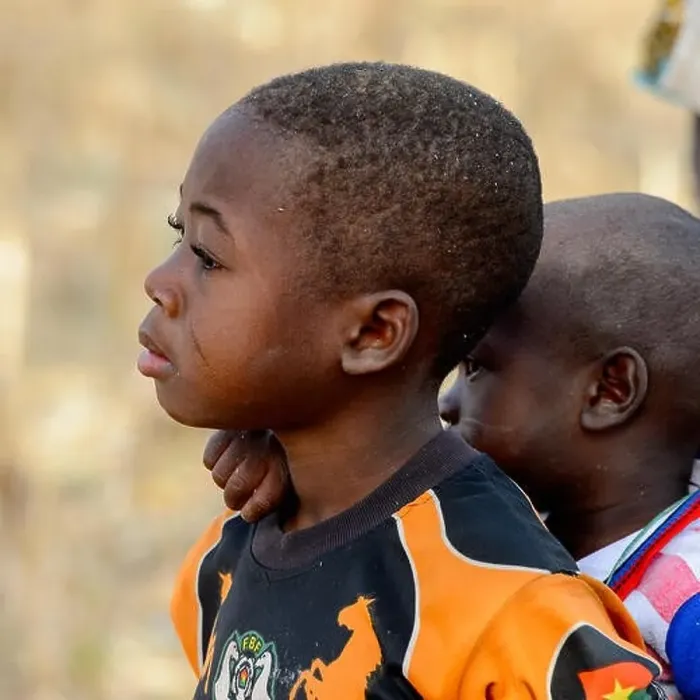 Framed Print : KOUTAMMAKOU, TOGO - JAN 13, 2017: Unidentified Togolese little boy carries his brother on his back in the village Framed Print : KOUTAMMAKOU, TOGO - JAN 13, 2017: Unidentified Togolese little boy carries his brother on his back in the village