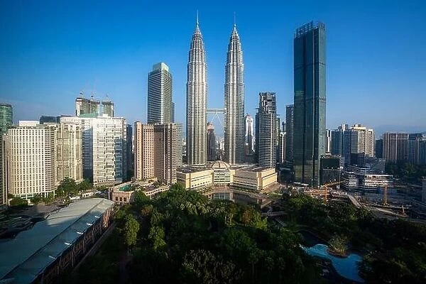 Kuala Lumpur city skyscraper and green space park with nice sky day at downtown business district in Kuala Lumpur. Malaysia. Malaysia tourism, modern