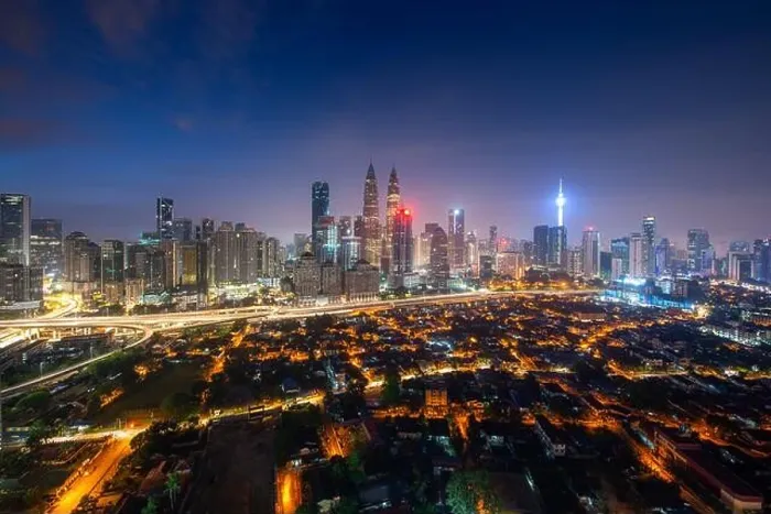Framed Print : Kuala Lumpur city skyscraper and street with nice sky twilight at downtown business district in Kuala Lumpur. Malaysia. Malaysia tourism, modern city