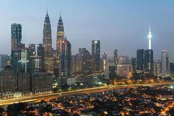 Kuala Lumpur skyline and skyscraper with highway road at night in Kuala Lumpur, Malaysia. Asia
