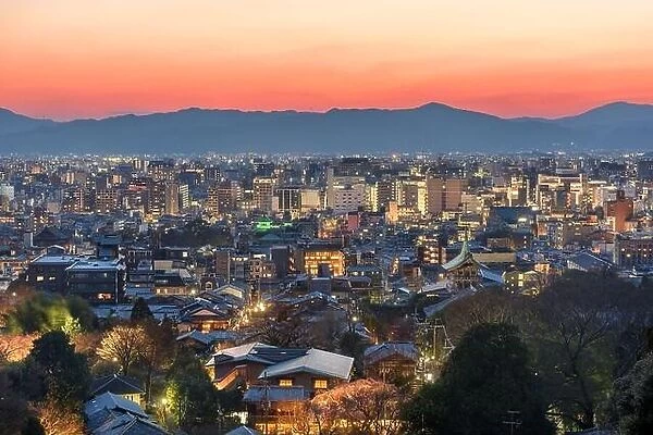 Kyoto, Japan downtown cityscape with new and old architecture at dusk
